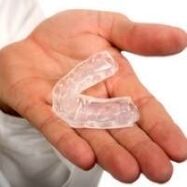 mouth guard to cut teeth, which is a symptom of the presence of parasites