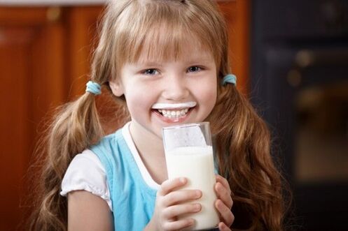 Girl drinks kefir to prevent parasites